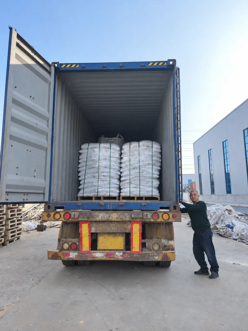 Palletized bags inside a shipping container during loading